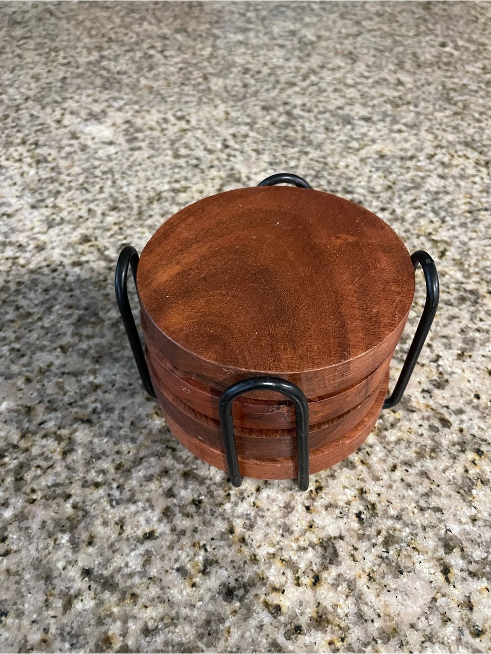 Set of Round Wooden Coasters with Black Metal Holder